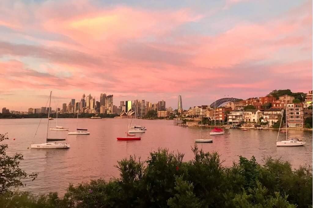 Overlooking Sydney Harbour, capturing the distant skyline of the city.